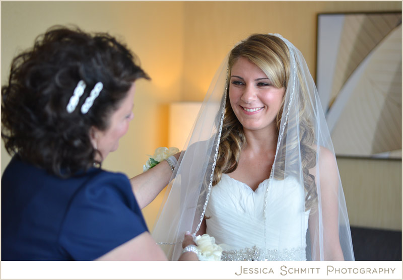 mother-of-the-bride-helps-bride-wedding wedding preparation getting ready photo
