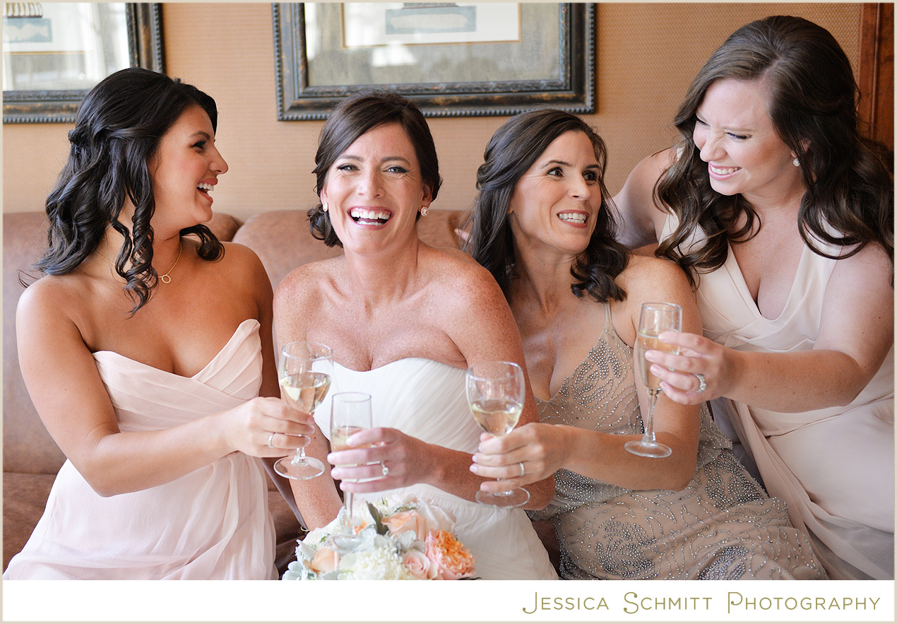 bride laughing with bridesmaids