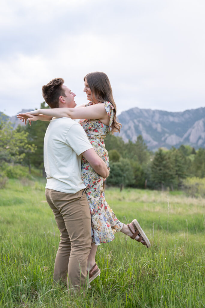 Happy couple in a field, Boulder engagement photographer