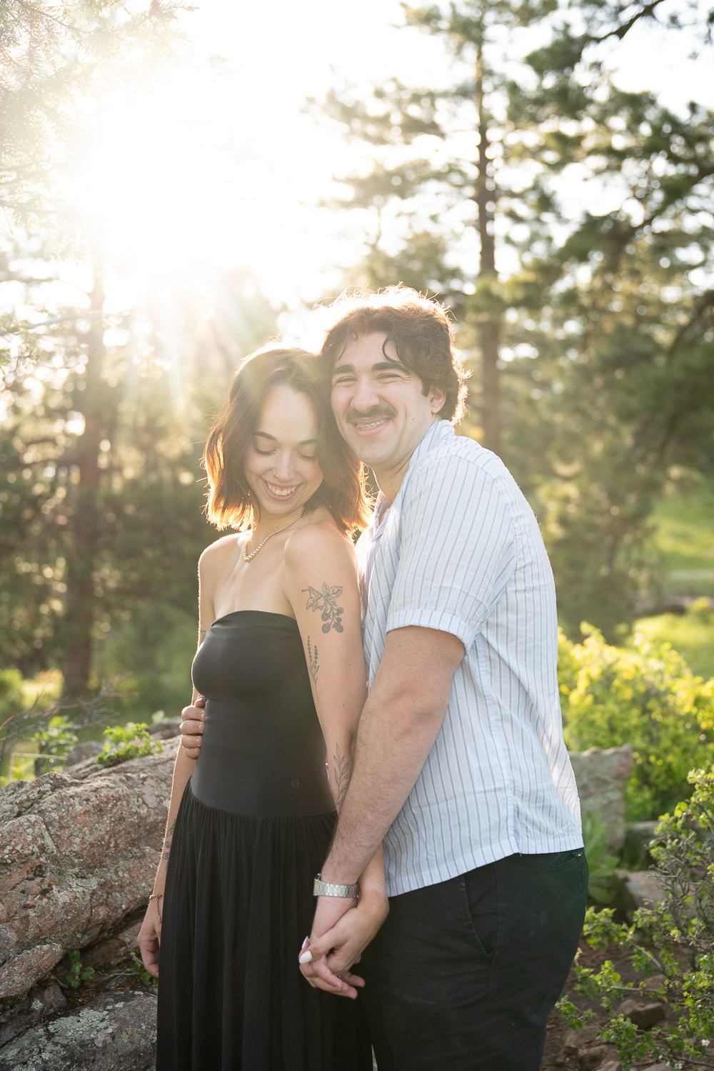 couple with sunshine in the Colorado mountains