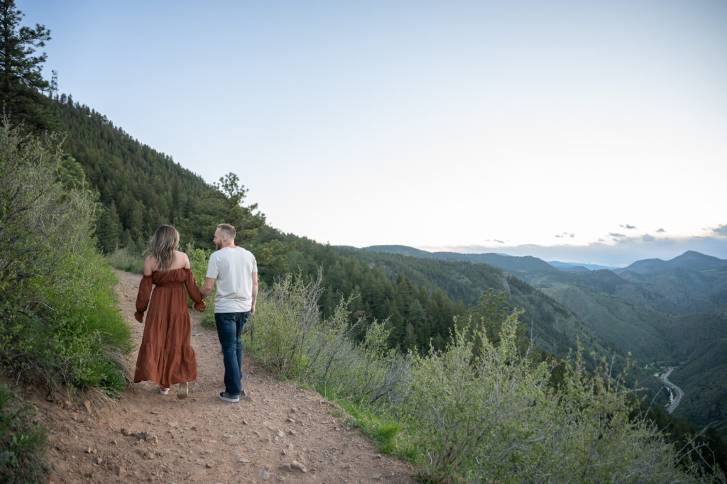 couple in love walking away at Lookout Mountain, denver engagement photographer
