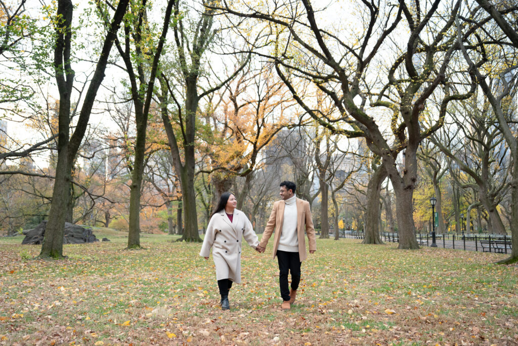 autumn in Central Park couple holding hands