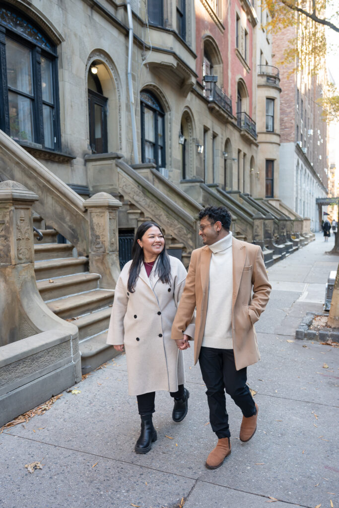 nyc engagement walking by brownstones